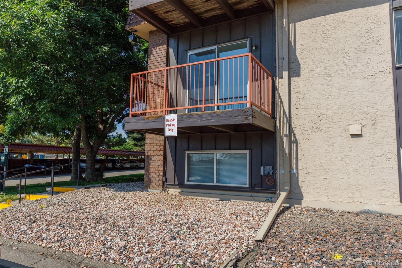 7755 East Quincy Avenue, Unit 205A5 Denver, CO 80237 - Photo 2 of 23 front view of a house with a small yard