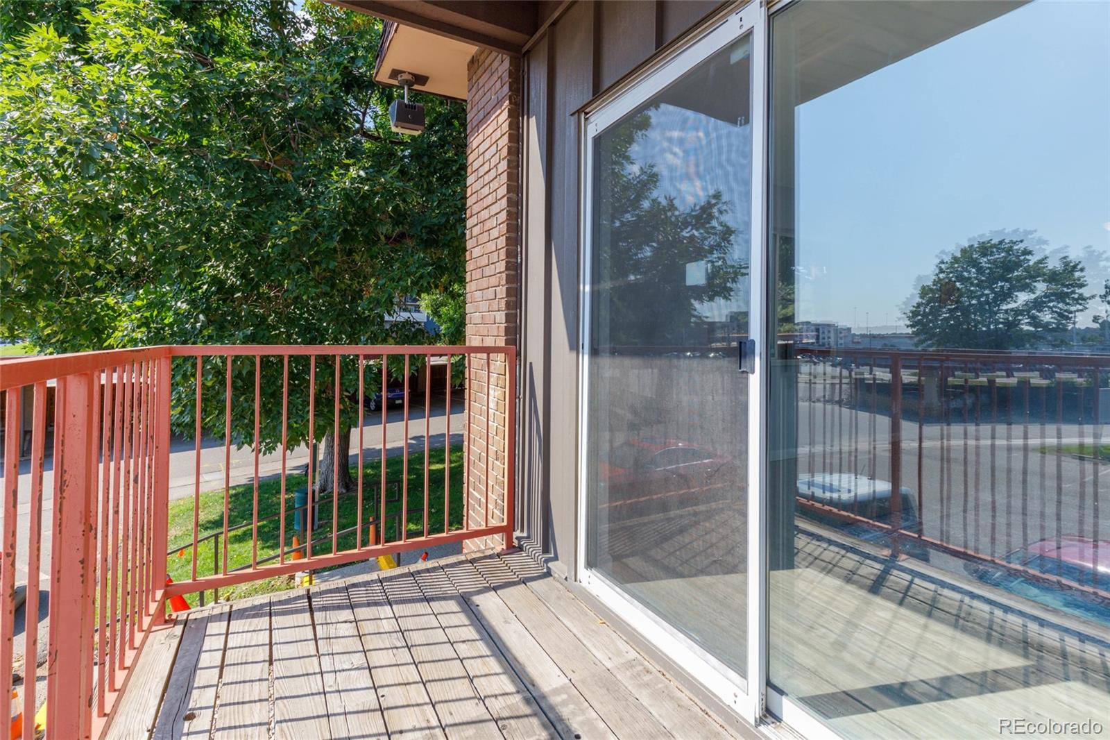 7755 East Quincy Avenue, Unit 205A5 Denver, CO 80237 - Photo 3 of 23 a view of a balcony with a potted plant