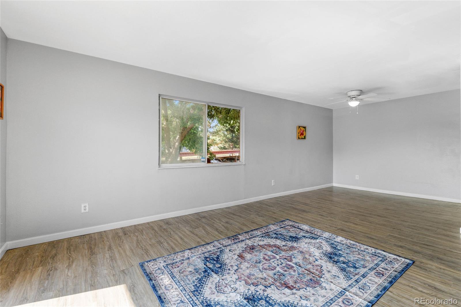 7755 East Quincy Avenue, Unit 205A5 Denver, CO 80237 - Photo 7 of 23 a view of an empty room and wooden floor