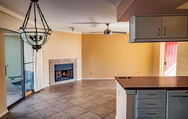 a kitchen with a sink and chandelier