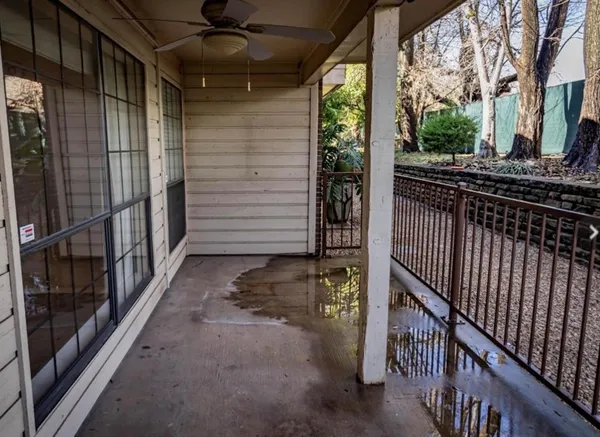 a view of a porch with wooden floor