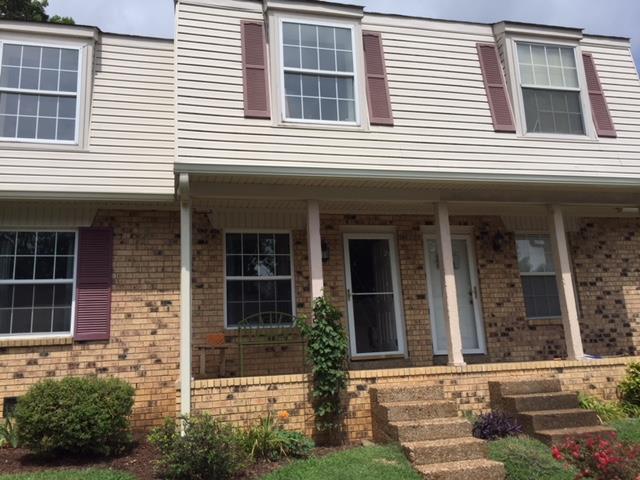 4000 Anderson Road, Unit 43 Nashville, TN 37217 - Photo 1 of 21 a front view of a house with a yard