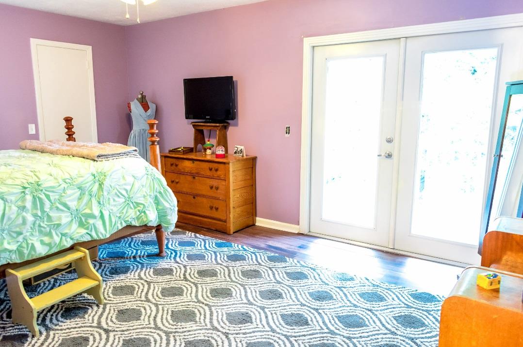4000 Anderson Road, Unit 43 Nashville, TN 37217 - Photo 11 of 21 a bedroom with a bed and wooden floor