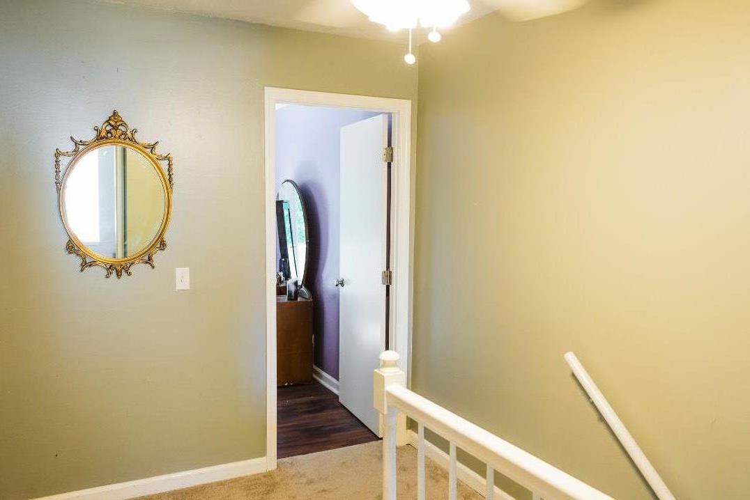 4000 Anderson Road, Unit 43 Nashville, TN 37217 - Photo 10 of 21 a view of a hallway with wooden floor and a bathroom