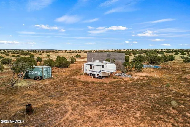a view of a lake with houses in front of it