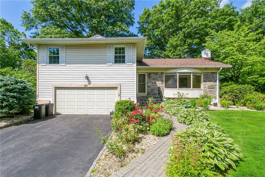 80 Sussex Road New Rochelle, NY 10804 - Photo 1 of 1 a house with a lot of flower plants in front of main door