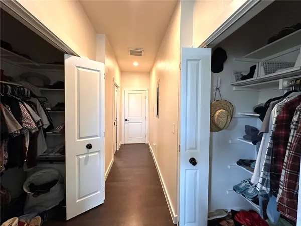 a view of hallway with walk in closet