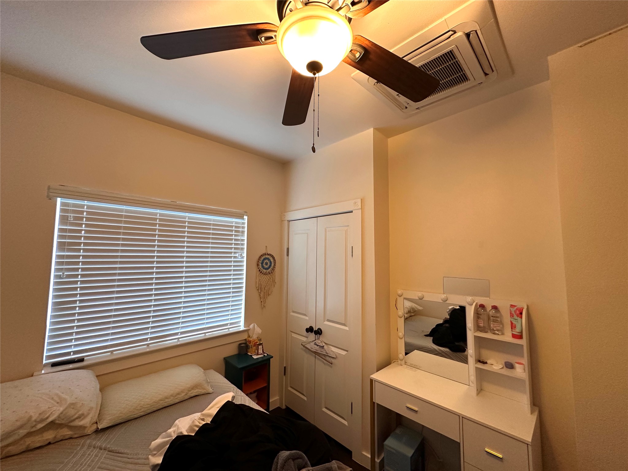 5004 Rowena Avenue, Unit A Austin, TX 78751 - Photo 18 of 24 a bedroom with a bed and a chandelier