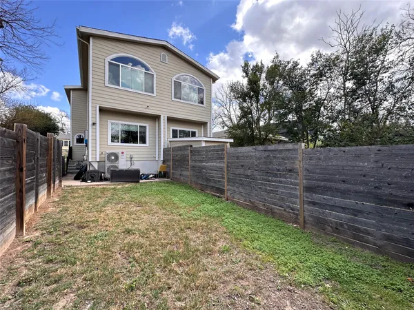 a house view with a backyard space