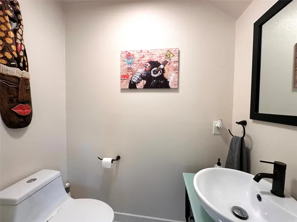 a bathroom with a toilet and a sink