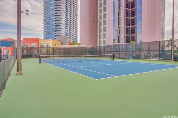 a view of an outdoor space and tennis court