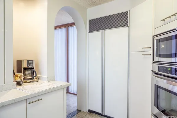 a room with a sink and a mirror