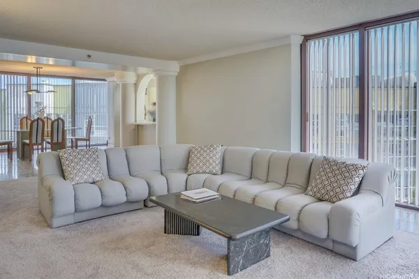 a living room with furniture and a large window