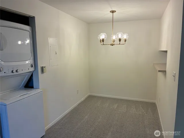 a view of a hallway with a chandelier