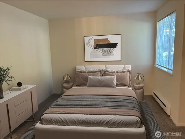 a bedroom with a bed and a couch