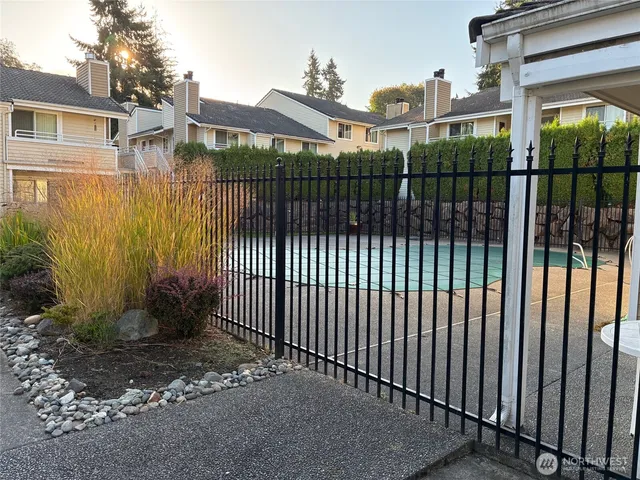 a view of a house with brick walls and a yard