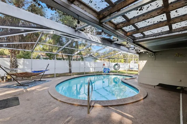 a view of a swimming pool with a patio