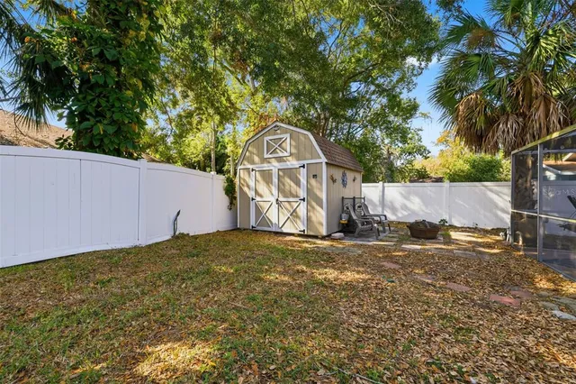 a view of backyard with swimming pool and outdoor seating