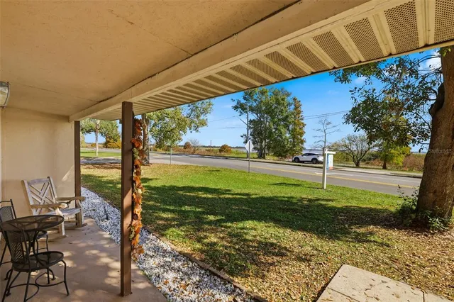 a view of house with yard