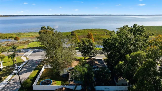 a view of field with grass and trees