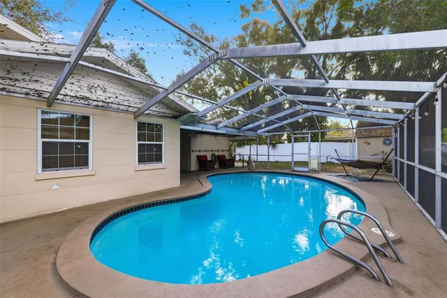 a view of a swimming pool with a patio
