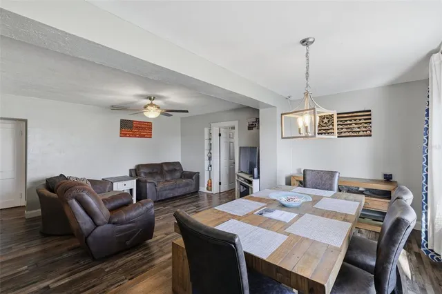 a living room with furniture a table and a window