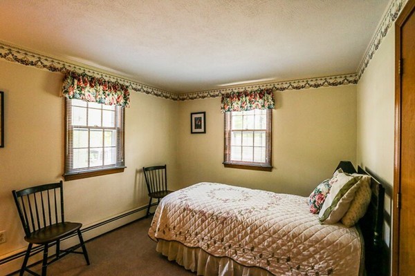 67 Bare Hill Road Topsfield, MA 01983 - Photo 12 of 22 a bedroom with a bed and a window