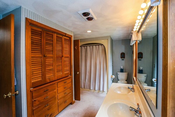 67 Bare Hill Road Topsfield, MA 01983 - Photo 16 of 22 a view of a hallway with closet and bathroom