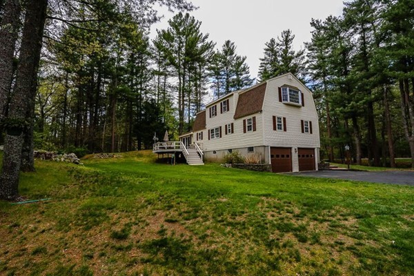 67 Bare Hill Road Topsfield, MA 01983 - Photo 20 of 22 a view of a house with a yard