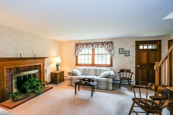 67 Bare Hill Road Topsfield, MA 01983 - Photo 2 of 22 a living room with furniture a fireplace and a window