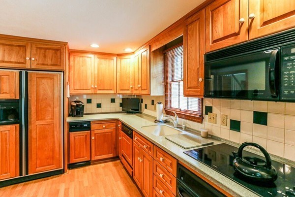 67 Bare Hill Road Topsfield, MA 01983 - Photo 4 of 22 a kitchen with stainless steel appliances granite countertop a sink stove and refrigerator
