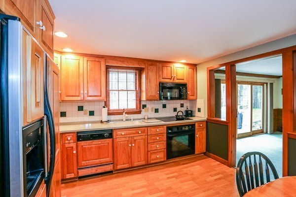 67 Bare Hill Road Topsfield, MA 01983 - Photo 5 of 22 a kitchen with stainless steel appliances granite countertop a sink stove and refrigerator