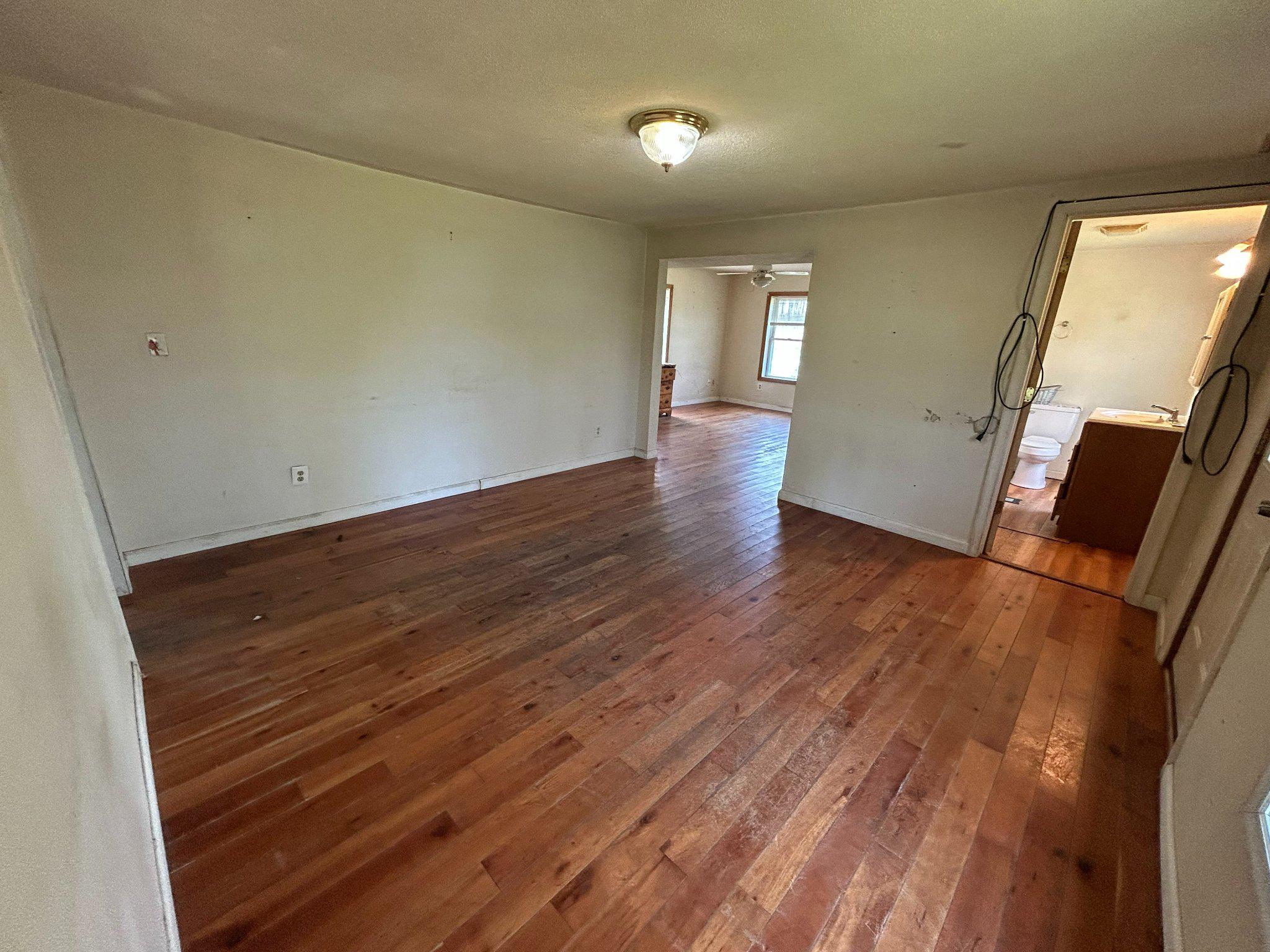 2439 Asquith Island Road Crapo, MD 21626 - Photo 8 of 14 Spacious room with warm wooden floors.