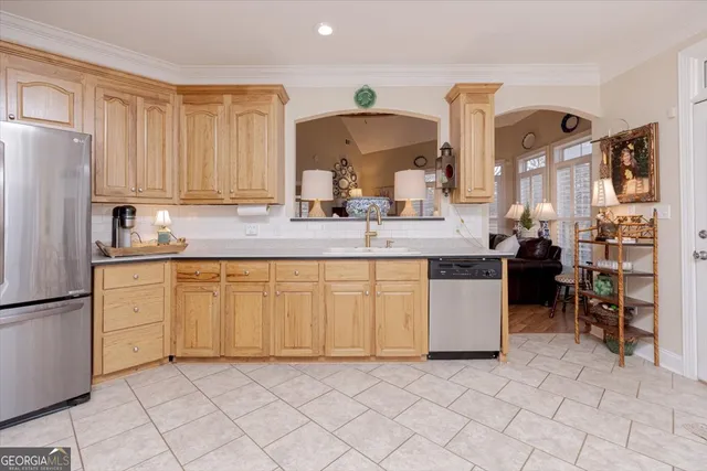 a living room with furniture a dining table and a large window