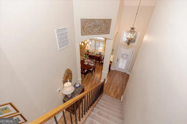 a dining room with furniture a livingroom and chandelier