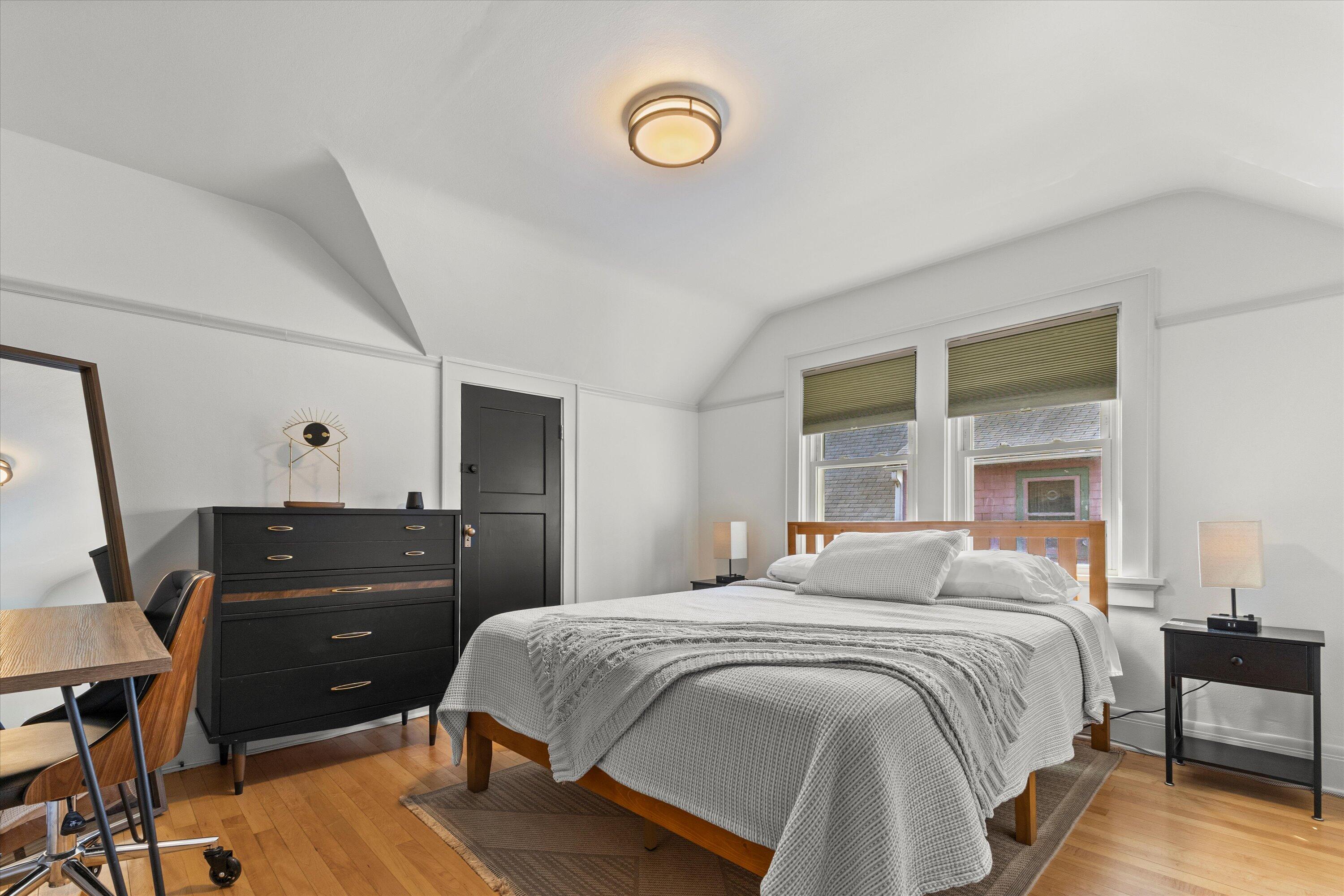 159 North 59th Street Milwaukee, WI 53213 - Photo 12 of 34 Spacious bedroom with hardwood floors and natural light
