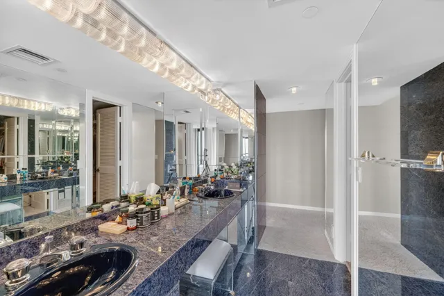 a bedroom with two beds and a night stand