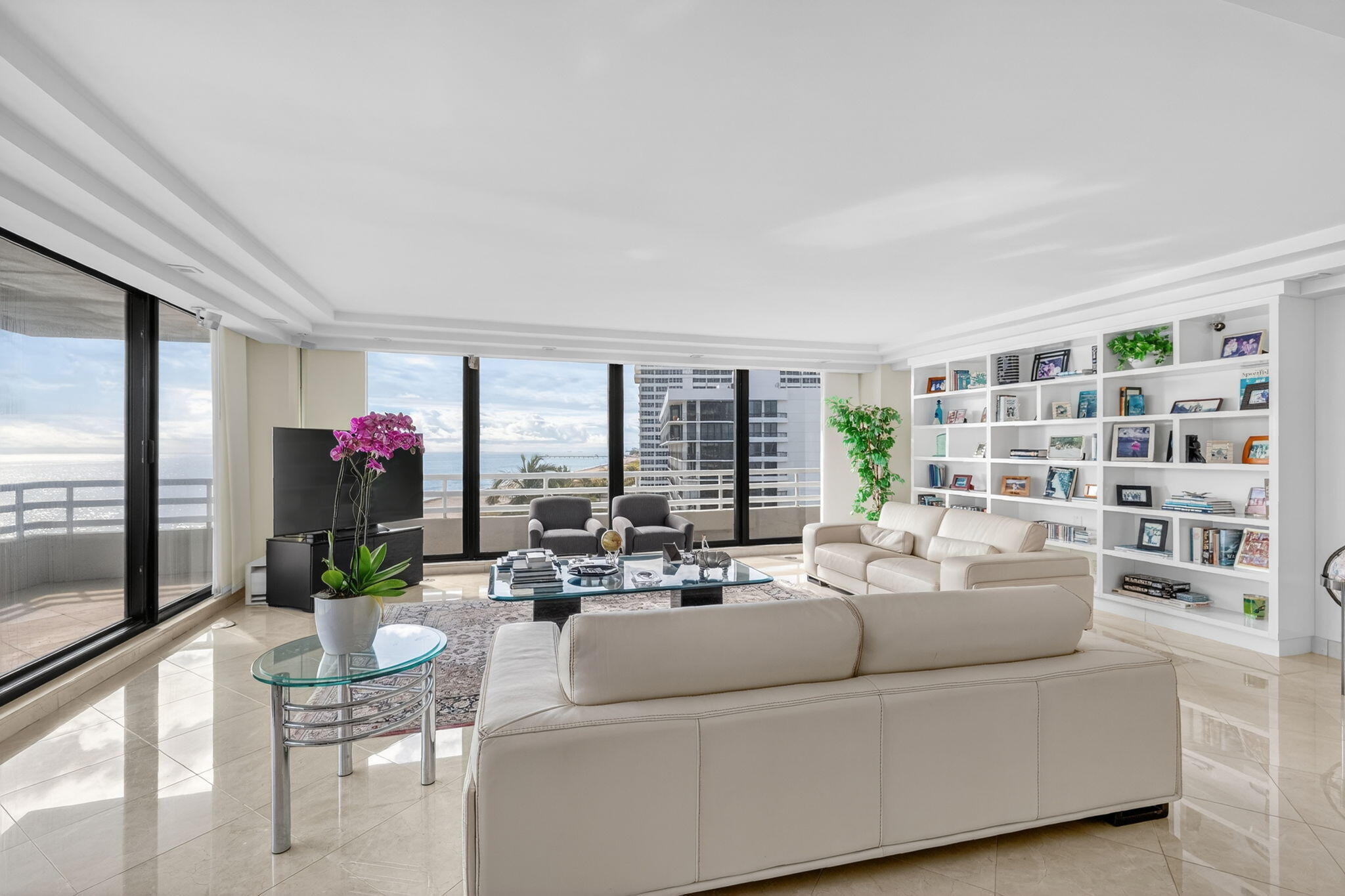 1500 South Ocean Boulevard, Unit 606 Boca Raton, FL 33432 - Photo 2 of 77 a living room with furniture and a potted plant