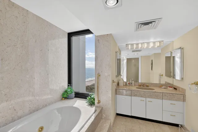 a view of a balcony and a floor to ceiling window