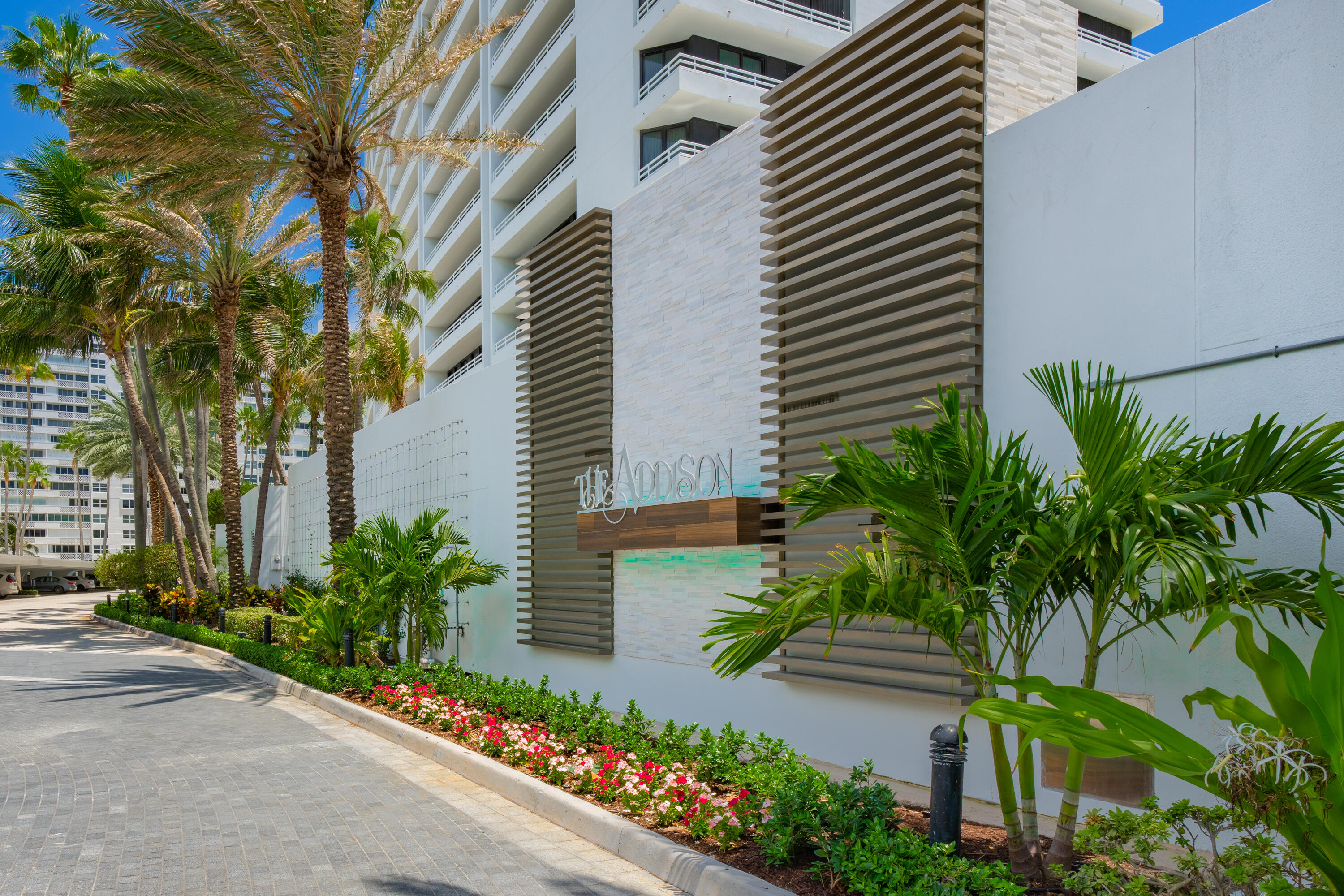 1500 South Ocean Boulevard, Unit 606 Boca Raton, FL 33432 - Photo 55 of 77 a front view of a house with a yard and potted plants