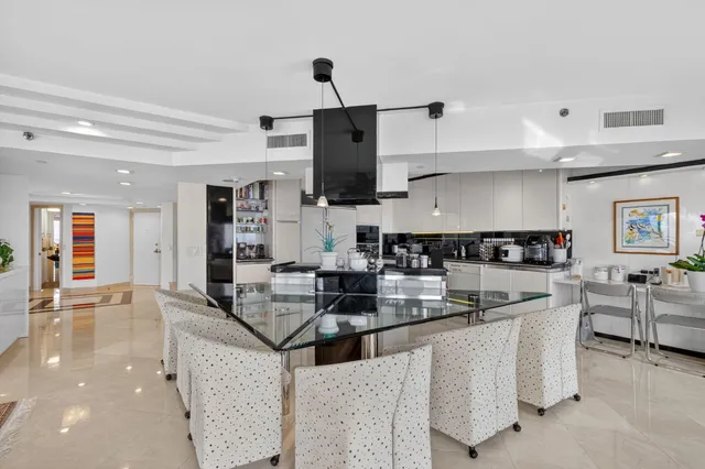 a kitchen with refrigerator and cabinets