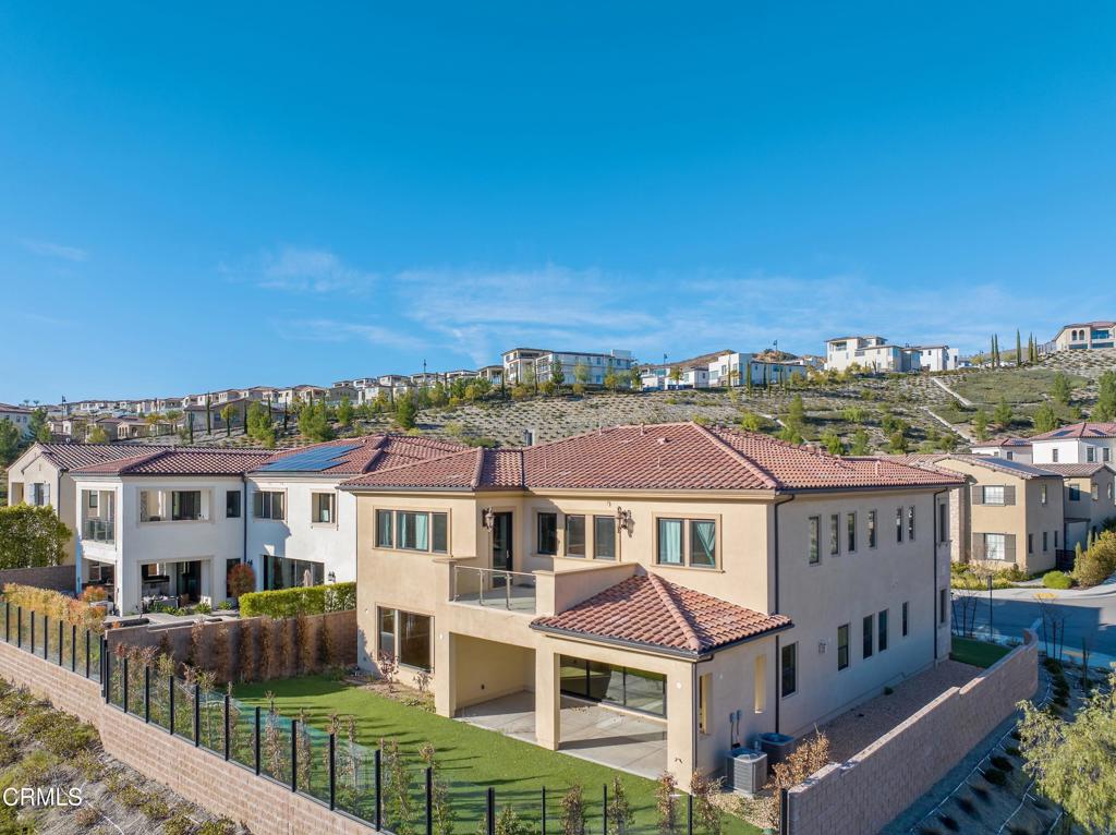 20156 West Cromwell Way Porter Ranch, CA 91326 - Photo 37 of 39 a front view of a house with a yard