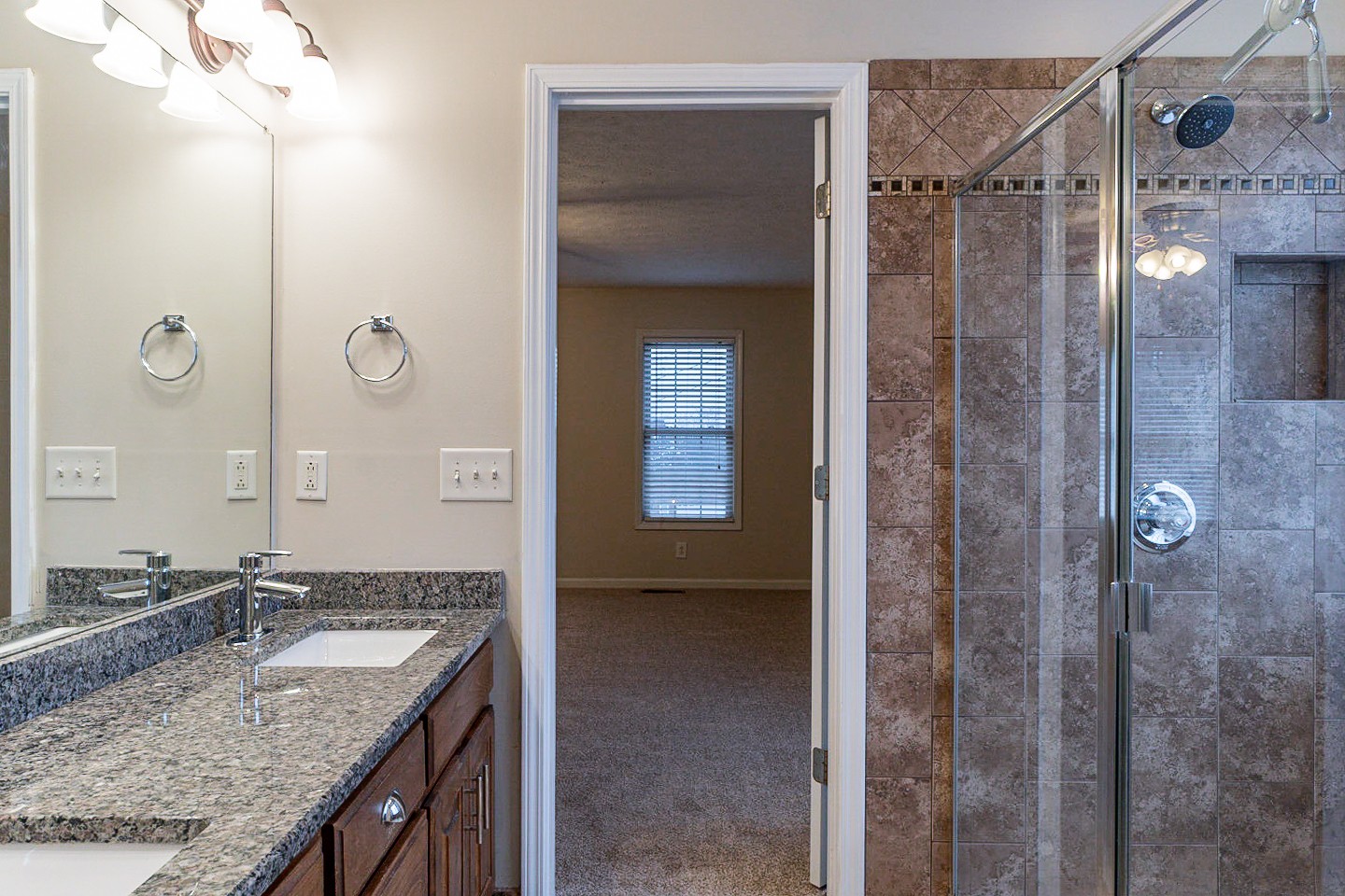 105 High Ridge Court Goodlettsville, TN 37072 - Photo 20 of 31 a bathroom with a granite countertop sink and a mirror