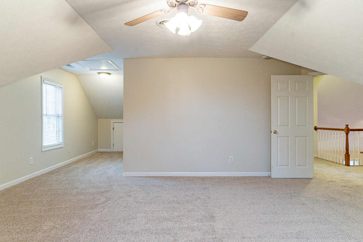 105 High Ridge Court Goodlettsville, TN 37072 - Photo 24 of 31 an empty room with windows and chandelier fan