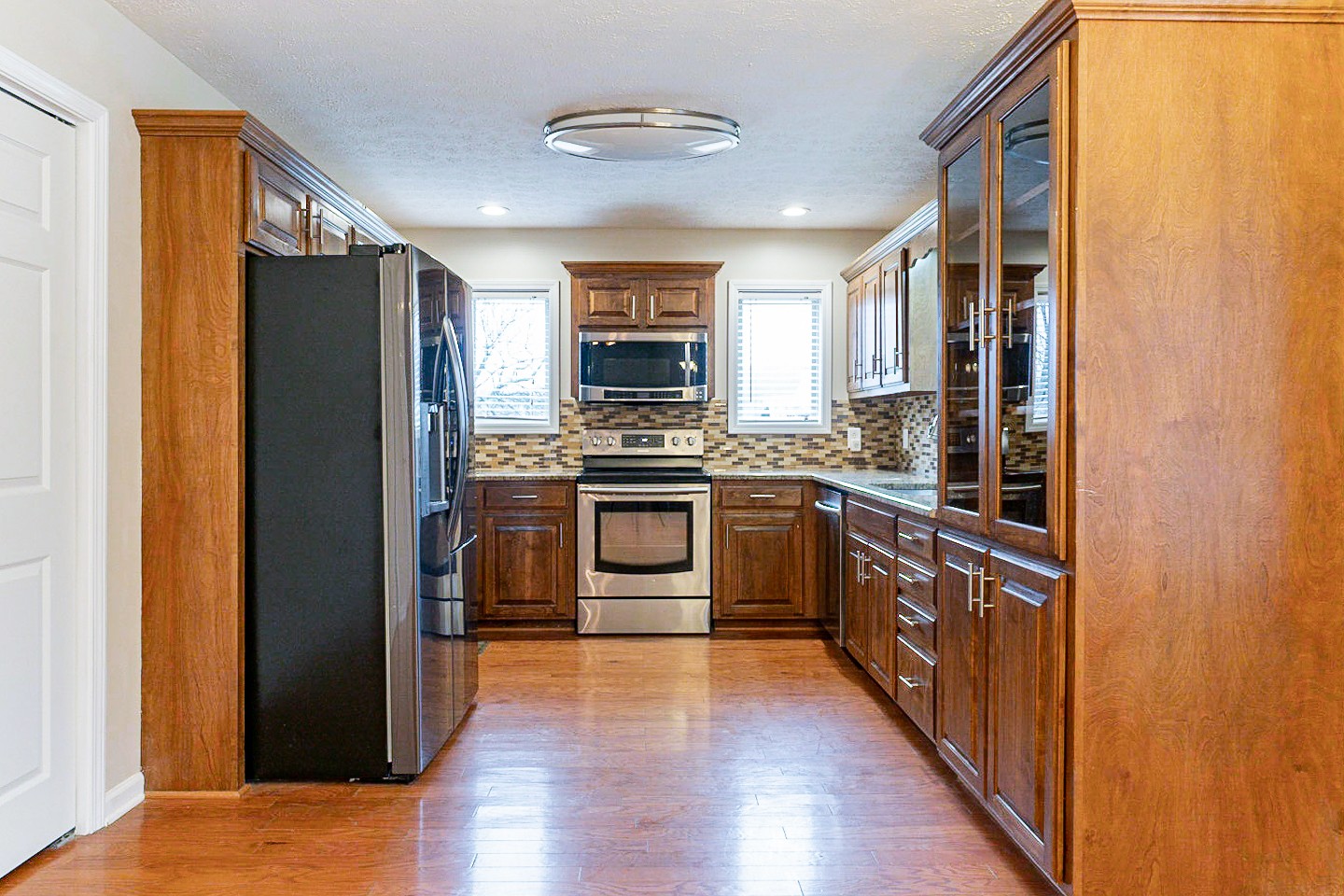 105 High Ridge Court Goodlettsville, TN 37072 - Photo 4 of 31 a kitchen with stainless steel appliances granite countertop a refrigerator and a stove top oven