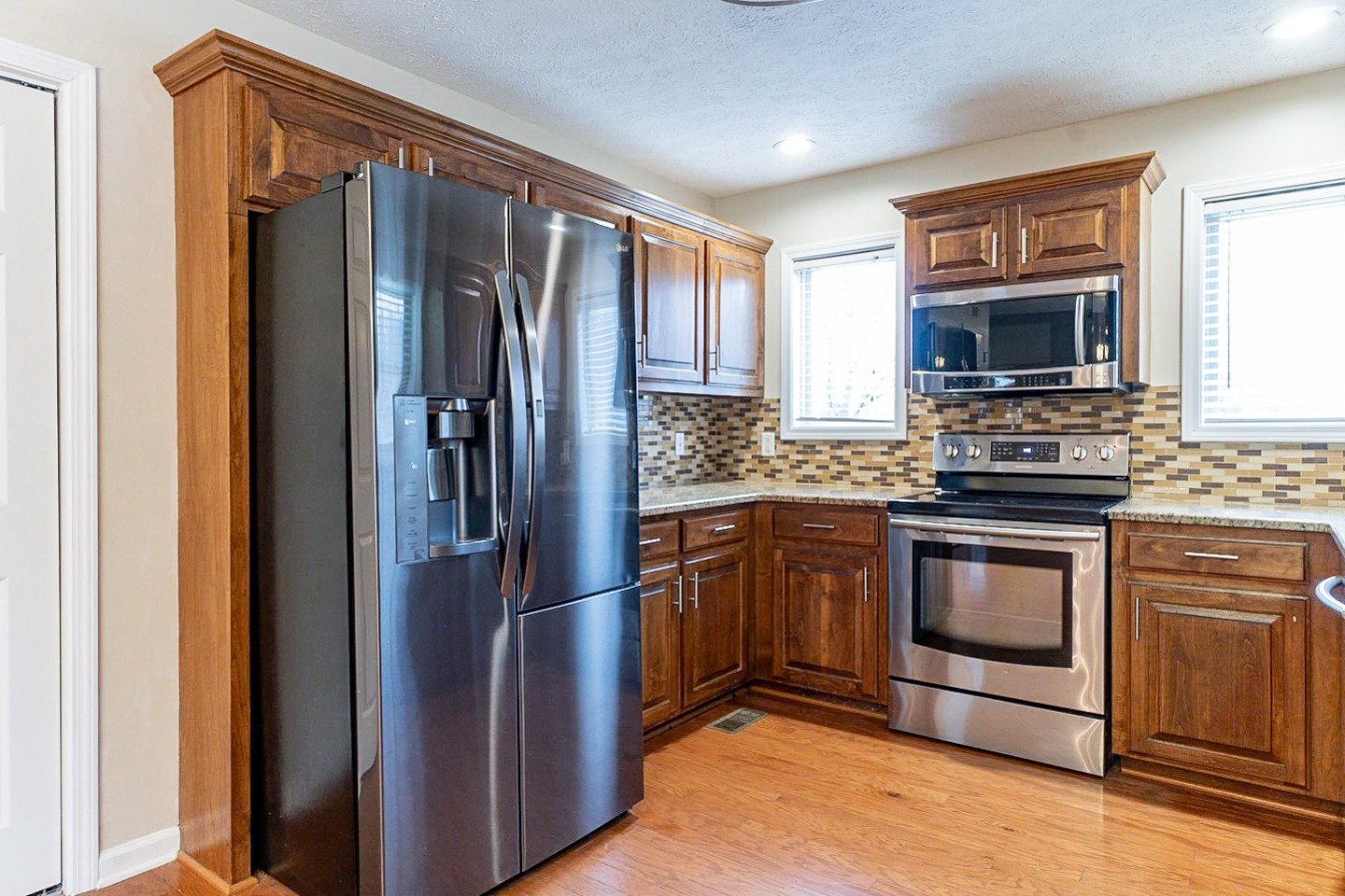 105 High Ridge Court Goodlettsville, TN 37072 - Photo 9 of 31 a kitchen with granite countertop stainless steel appliances and wooden cabinets
