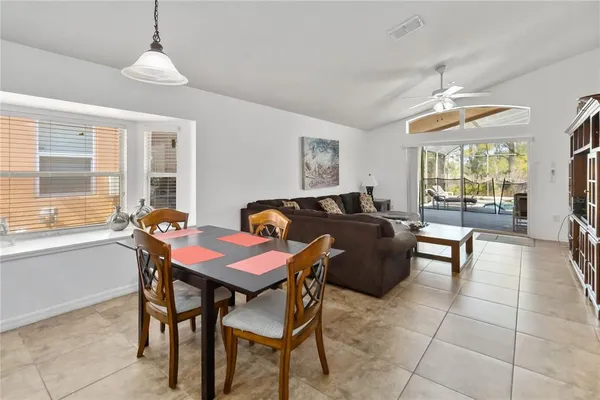 a dining room with furniture and window