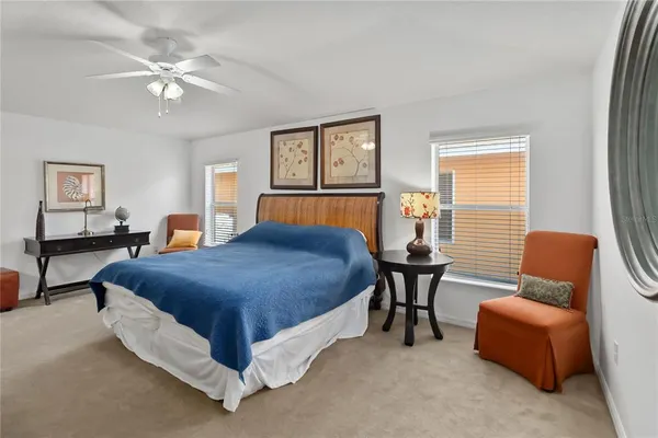 a bedroom with a bed and a couch