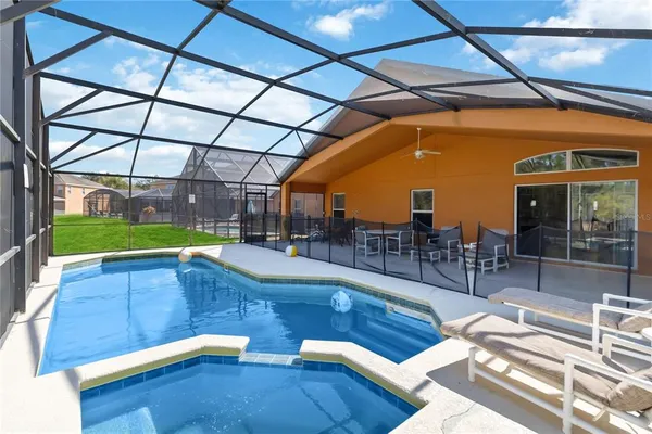 a view of a swimming pool with a patio