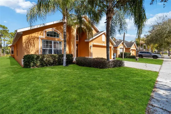 a view of a house with a yard